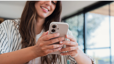 Woman Smiling Phone In Hand